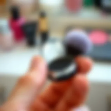Compact Design for On-the-Go Beauty Close-up of a hand holding a compact makeup brush