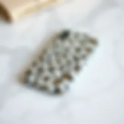 Elegant white cheetah print phone case on a marble surface