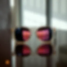 Stylish clear frame mirrored sunglasses on a reflective surface