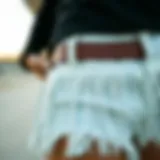 Close-up view of fringe detailing on cowgirl shorts