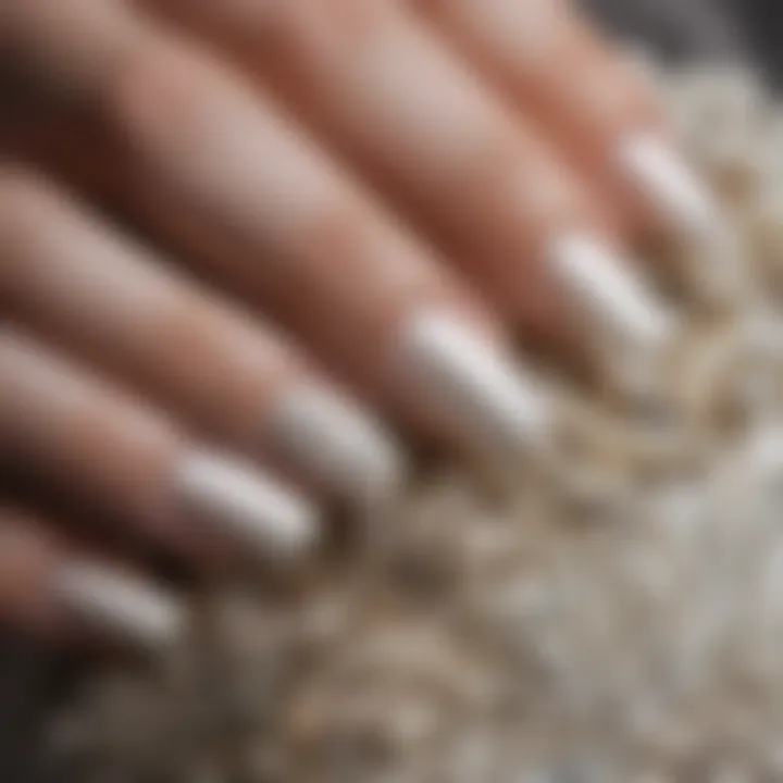 Close-up of nail artistry showcasing intricate pearl details