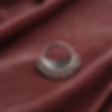 Moon Septum Ring on Velvet Elegant display of a moon septum ring atop a velvet surface