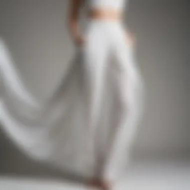 Elegant Draping of Chiffon Pants Sophisticated white chiffon pants draped elegantly on a model.