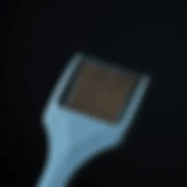 Precision Tools for Hair Styling A close-up view of a heat-resistant rat tail comb showcasing its fine teeth and pointed tail, ideal for precision styling.