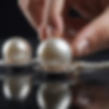 Artisan crafting a piece of jewelry featuring floating pearls