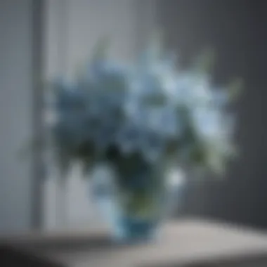 Elegant arrangement of ice blue artificial flowers in a stylish vase