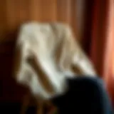 A stylish cardigan draped elegantly on a vintage chair