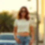 A stylish short sleeve crop top paired with high-waisted jeans.