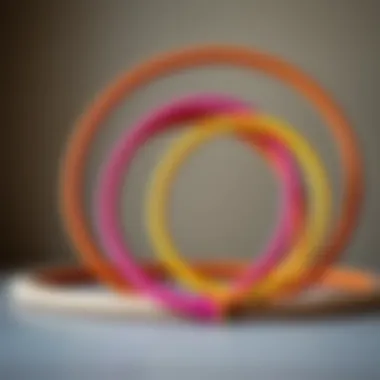 Diverse Sizes and Designs of Padded Hula Hoops An artistic arrangement of various padded hula hoops in different sizes.