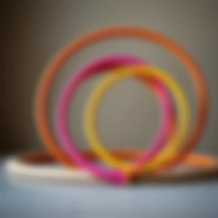 Diverse Sizes and Designs of Padded Hula Hoops An artistic arrangement of various padded hula hoops in different sizes.