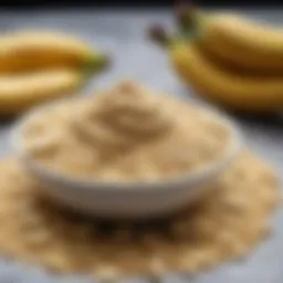 Close-up of banana powder in a bowl with fresh bananas beside it