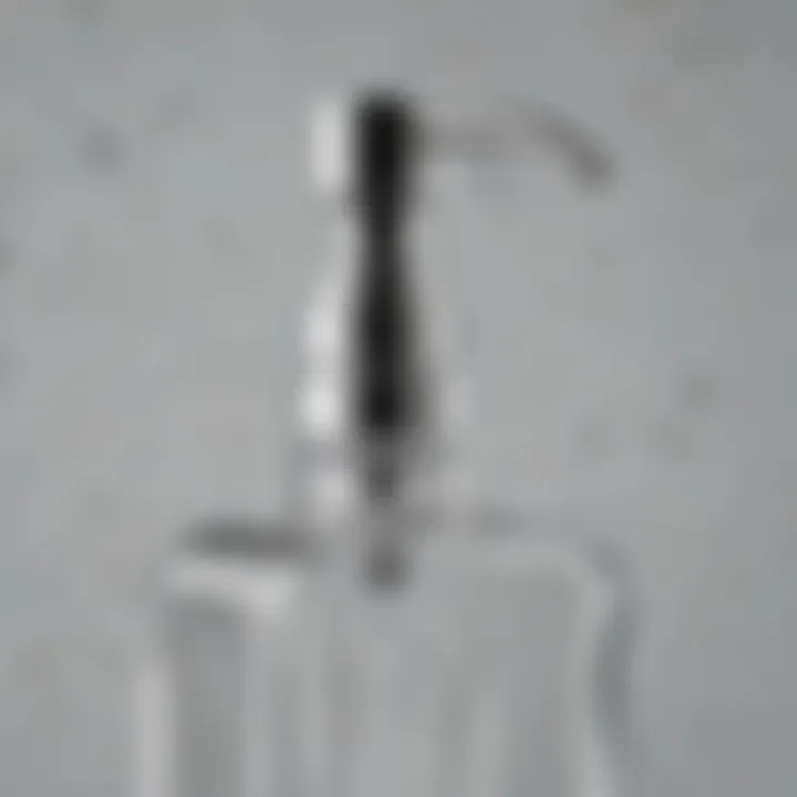 Close-up of a square glass soap dispenser highlighting its material