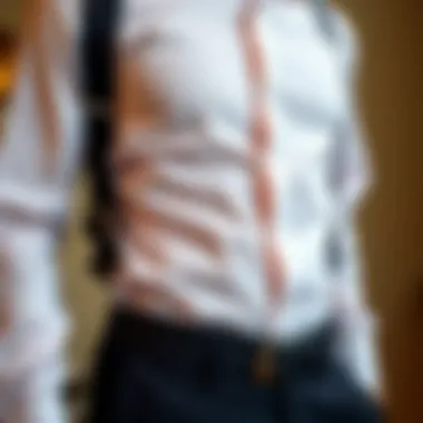 Man wearing a shirt holder garter under a formal shirt